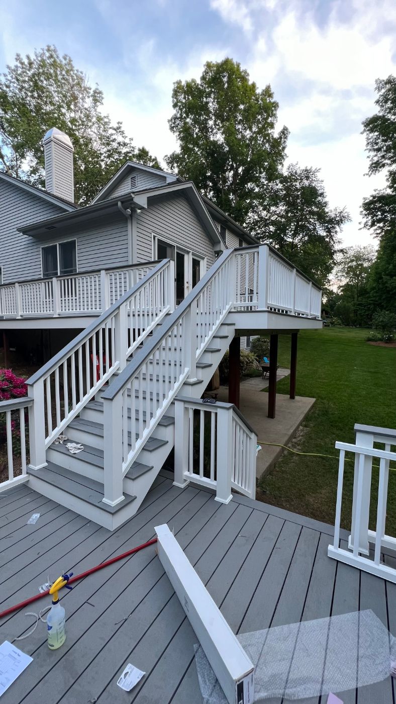 Upper deck and stairway with white railings in Johnston, RI
